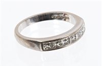 Lot 718 - 18ct white gold and diamond eternity ring with...