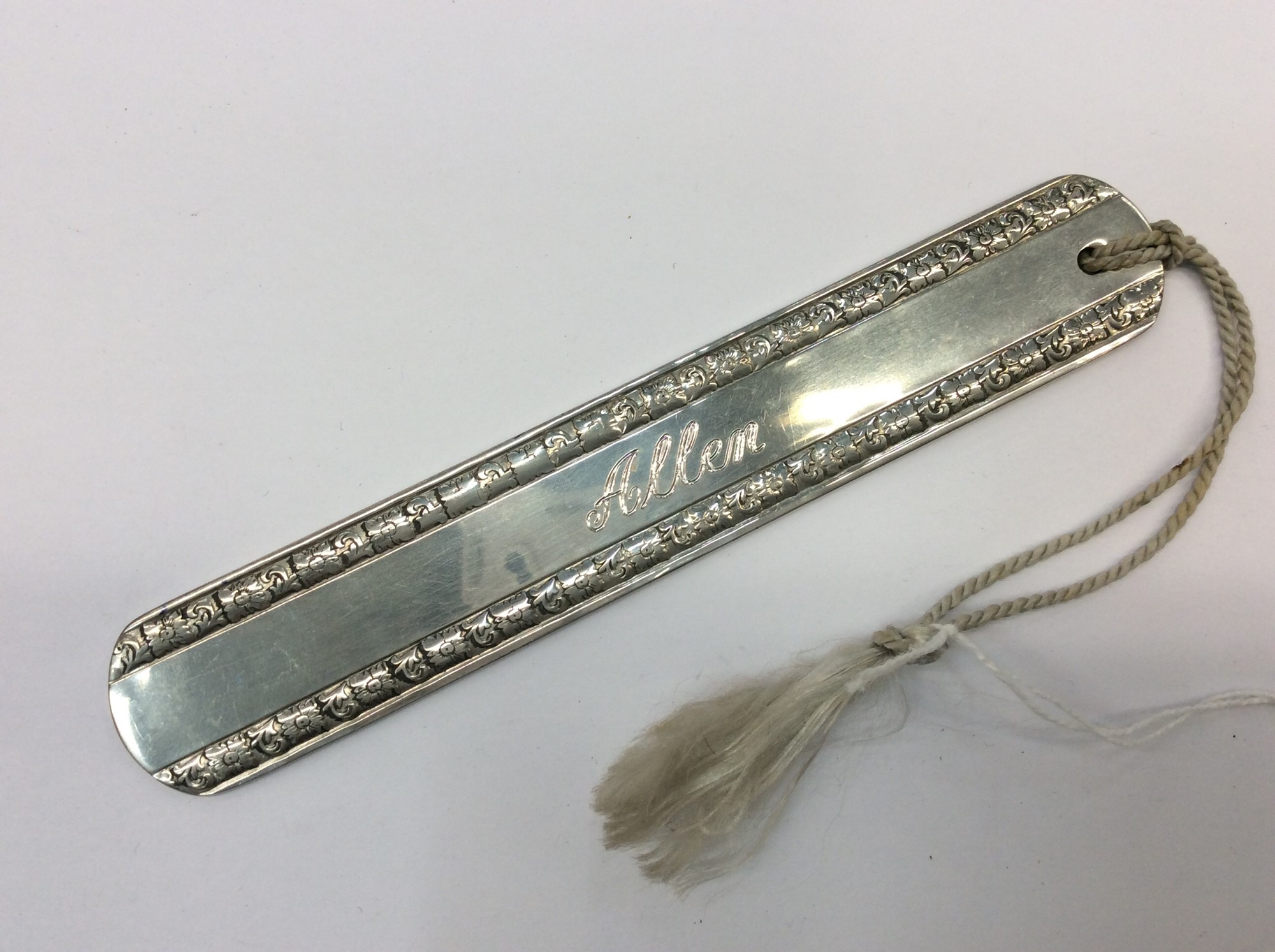 Lot 662 - Good quality silver plated bookmark engraved