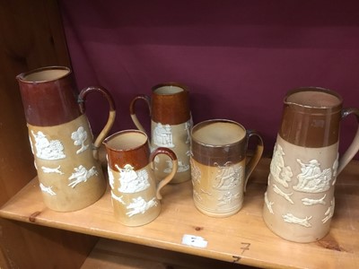 Lot 179 - Four Doulton Lambeth stoneware jugs and a similar tankard