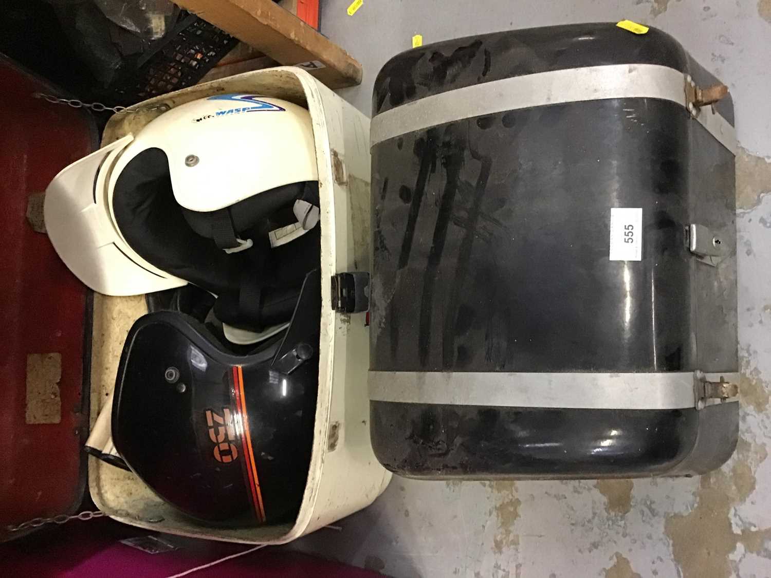 Lot 555 - Two motor cycle top boxes and two helmets