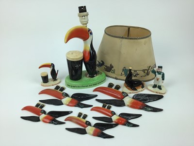 Lot 114 - Five Carlton Ware Guinness toucan wall plaques, lamp (broken) and three ‘My Goodness’ figures