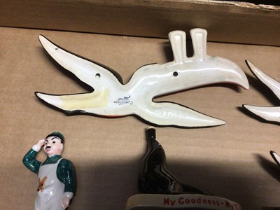 Lot 114 - Five Carlton Ware Guinness toucan wall plaques, lamp (broken) and three ‘My Goodness’ figures