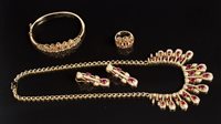 Lot 728 - Eastern yellow metal ruby and diamond suite of...