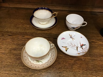 Lot 149 - Royal Worcester cup and saucer with floral decoration, another Worcester cup with bird decoration, Worcester saucer with dragonfly, and Coalport cup and saucer