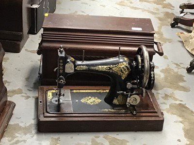 Lot 342 - Four vintage sewing machines in cases including Singer