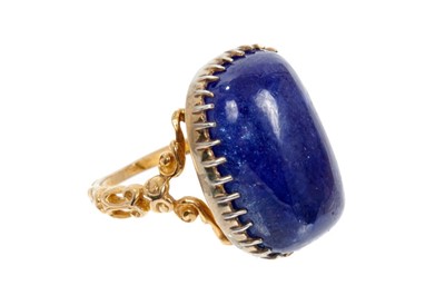 Lot 451 - Gold dress ring with cabochon blue gem-stone