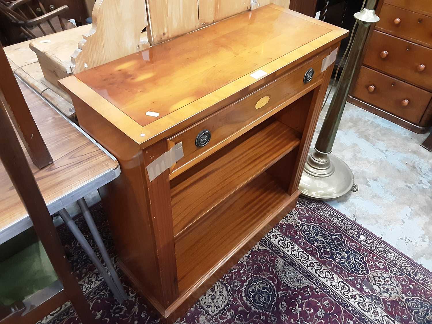 Lot 1037 - Yew wood open bookcase with single drawer