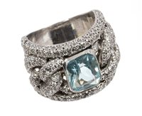 Lot 743 - Aquamarine and diamond ring, the wide band...