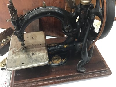 Lot 1916 - Wilcox and Gibbs sewing machine in case