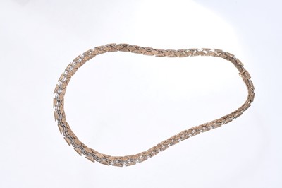 Lot 533 - 9ct gold necklace with articulated white and yellow gold links, London import hallmarks for 1975, approximately 39.1 grams