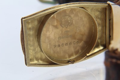 Lot 615 - 1920s mid-size Omega 18ct gold wristwatch with tonneau shape gold case, import hallmarks for Edinburgh 1928, on brown leather strap