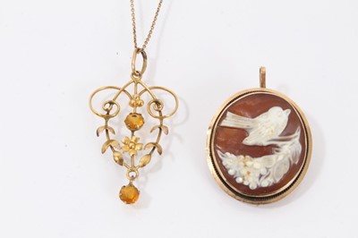 Lot 535 - Edwardian 9ct gold citrine pendant on a chain and a carved shell cameo in pendant/brooch mount