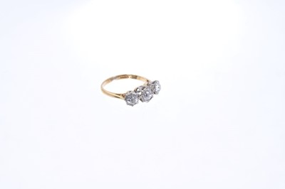 Lot 558 - Diamond three stone ring in collet setting on 18ct gold shank