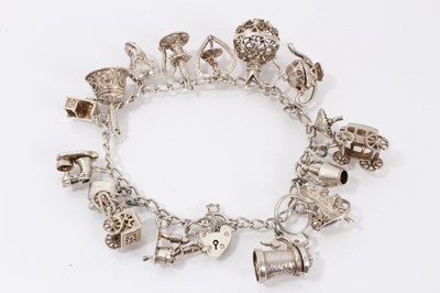 Lot 564 - Silver charm bracelet