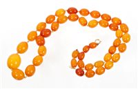 Lot 755 - Old amber necklace with a long string of forty-...