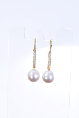 Lot 559 - Pair of cultured pearl and diamond pendant earrings in 18ct gold setting