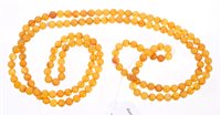 Lot 760 - Amber necklace with a long string of spherical...