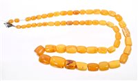 Lot 763 - Amber bead necklace with graduated amber beads,...