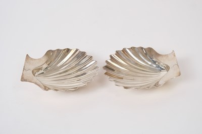 Lot 350 - Pair of George III silver butter shells on three shell formed feet