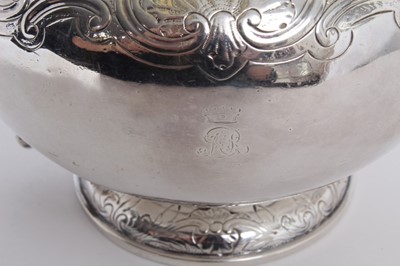 Lot 210 - George IV silver teapot of bullet form with chased scroll and shell decoration, engraved Ducal crown and initials, flush fitting hinged cover with ivory finial and ivory scroll handle, raised on pe...