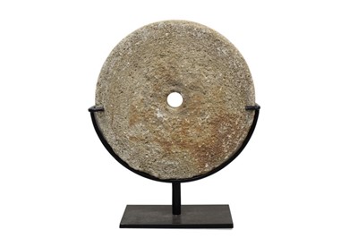 Lot 1254 - Antique Greek millstone, on metal stand: Provenance: from the Greek Island of Chios