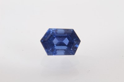 Lot 427 - Unmounted blue sapphire, the hexagonal step cut stone measuring approximately 10.48mm x 7.03mm x 6.79mm