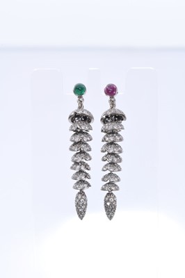 Lot 401 - Pair of diamond pendant earrings, each with an articulated drop