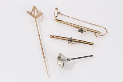 Lot 519 - Masonic gold stick pin and two Edwardian 15ct gold bar brooches, one with aquamarines and the other with sapphires