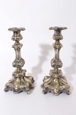 Lot 354 - Pair of 19th century Continental silver plated candlesticks with eagles head design