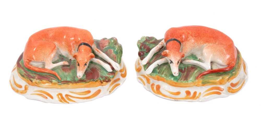 Lot 28 - Small pair of Victorian Staffordshire figures of recumbent greyhounds