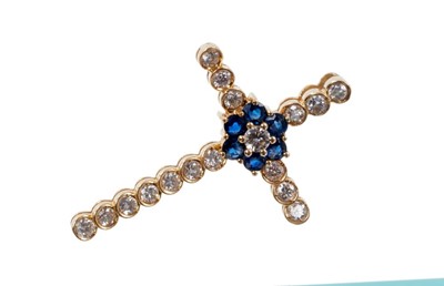 Lot 418 - Diamond and sapphire cross pendant with a central sapphire and diamond floral cluster, all in 18ct gold setting 33mm x 22mm