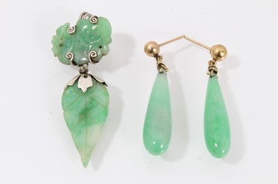 Lot 430 - Pair of jade/green hardstone pendant earrings, each with a single pear-shape drop, 35mm, together with a single carved jade earring