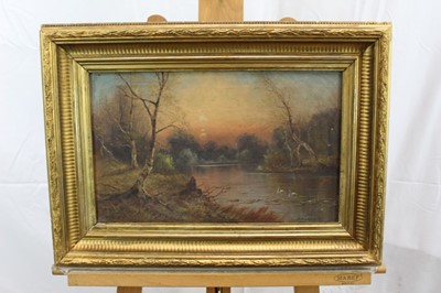 Lot 1192 - Nils Hans Christiansen pair of oils - river landscapes, in gilt frames
