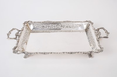 Lot 234 - Good Quality Edwardian Silver serving dish of rectangular form with pierced decoration, cast scroll borders and twin scroll handles, raised on four shell and scroll feet, (Birmingham 1905), Maker S...