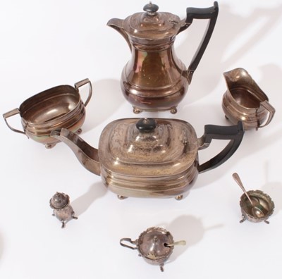 Lot 235 - George VI silver four piece tea and coffee set- comprising teapot of compressed baluster form, hinged domed cover, angular ebony handle, raised on four ball feet, matching coffee pot, sugar and cre...
