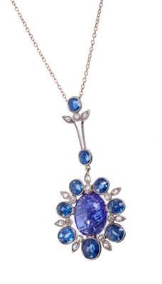 Lot 438 - Edwardian sapphire and diamond pendant necklace with an oval cabochon blue sapphire weighing approximately 7.25 carats, surrounded by seven oval mixed cut blue sapphires interspaced by rose cut dia...