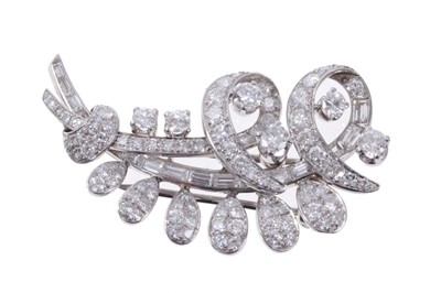 Lot 478 - 1950s diamond spray brooch, the stylised floral spray with brilliant, single and baguette cut diamonds estimated to weigh approximately 3.25 carats in total. 45mm