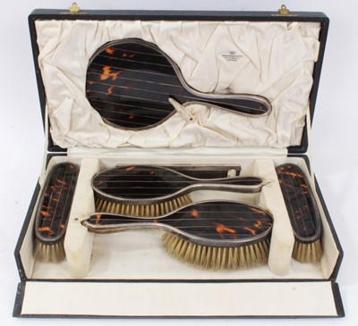 Lot 730 - Art Deco silver and tortoiseshell dressing table set, cased