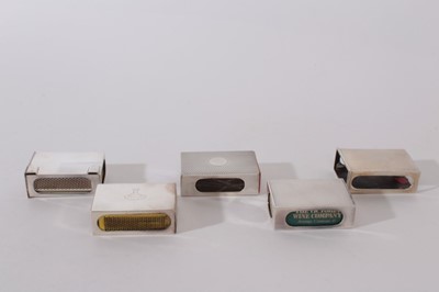 Lot 243 - George V silver match box cover of conventional form, with engine turned decoration and engraved date '26.5.36' (London 1935), together with four other silver match box covers (various dates and ma...