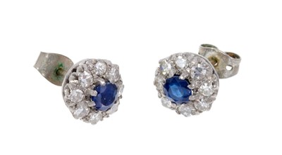 Lot 496 - Pair of sapphire and diamond cluster earrings