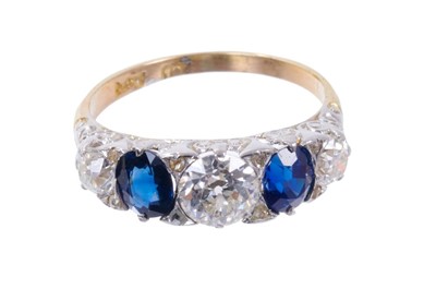 Lot 499 - Late Victorian diamond and sapphire five stone ring with three old cut diamonds interspaced by two oval mixed cut blue sapphires in carved scroll settting with rose cut diamond cents to the claws o...