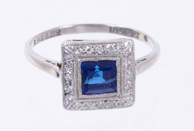 Lot 500 - Art Deco style sapphire and diamond cluster ring with a square step cut blue sapphire surrounded by a border of single cut diamonds in platinum millegrain setting on 18ct white gold shank. Ring siz...