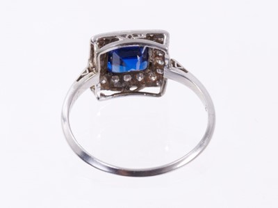 Lot 500 - Art Deco style sapphire and diamond cluster ring with a square step cut blue sapphire surrounded by a border of single cut diamonds in platinum millegrain setting on 18ct white gold shank. Ring siz...