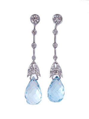 Lot 501 - Pair of aquamarine and diamond pendant earrings, each with a briollette cut aquamarine suspended from a line of diamonds. 36mm