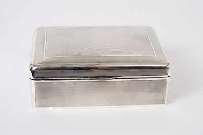 Lot 281 - Large George V silver cigarette box of rectangular form with engine turned decoration, domed hinged cover with gilded interior opening to reveal cedar lined interior, (Birmingham 1912)