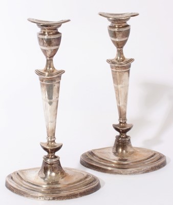 Lot 276 - Pair of George V Georgian style silver candlesticks of navette form, tapered stems with reeded decoration, separate sconces with reeded decoration, on stepped navette bases (Birmingham 1913