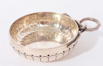 Lot 283 - Early 20th century French silver wine taster of circular form with loop handle in the form of a serpent, Stamped Boin Taburet, Paris and marked with Minerva head, 8.5cm in diameter