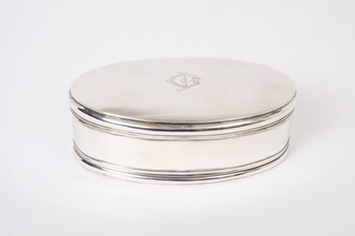 Lot 274 - George V silver jewellery / trinket box of oval form with hinged cover, engraved initials to centre and velvet lined interior, (London 1911), Maker William Comyns, 17cm in overall length