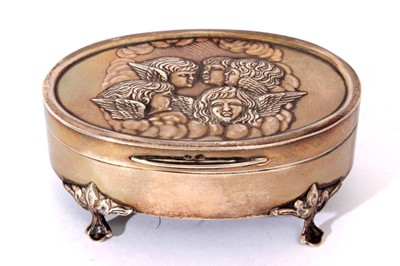 Lot 262 - Edwardian silver jewellery box of oval form with embossed 'Reynolds Angles' decoration to lid, velvet lined interior, raised on four hoof feet, (Birmingham 1906) maker, Henry Manton, 11cm in length