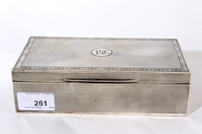 Lot 261 - George V silver cigarette box of rectangular form with engined turned decoration, hinged lid with Greek Key border, Cedar lined interior